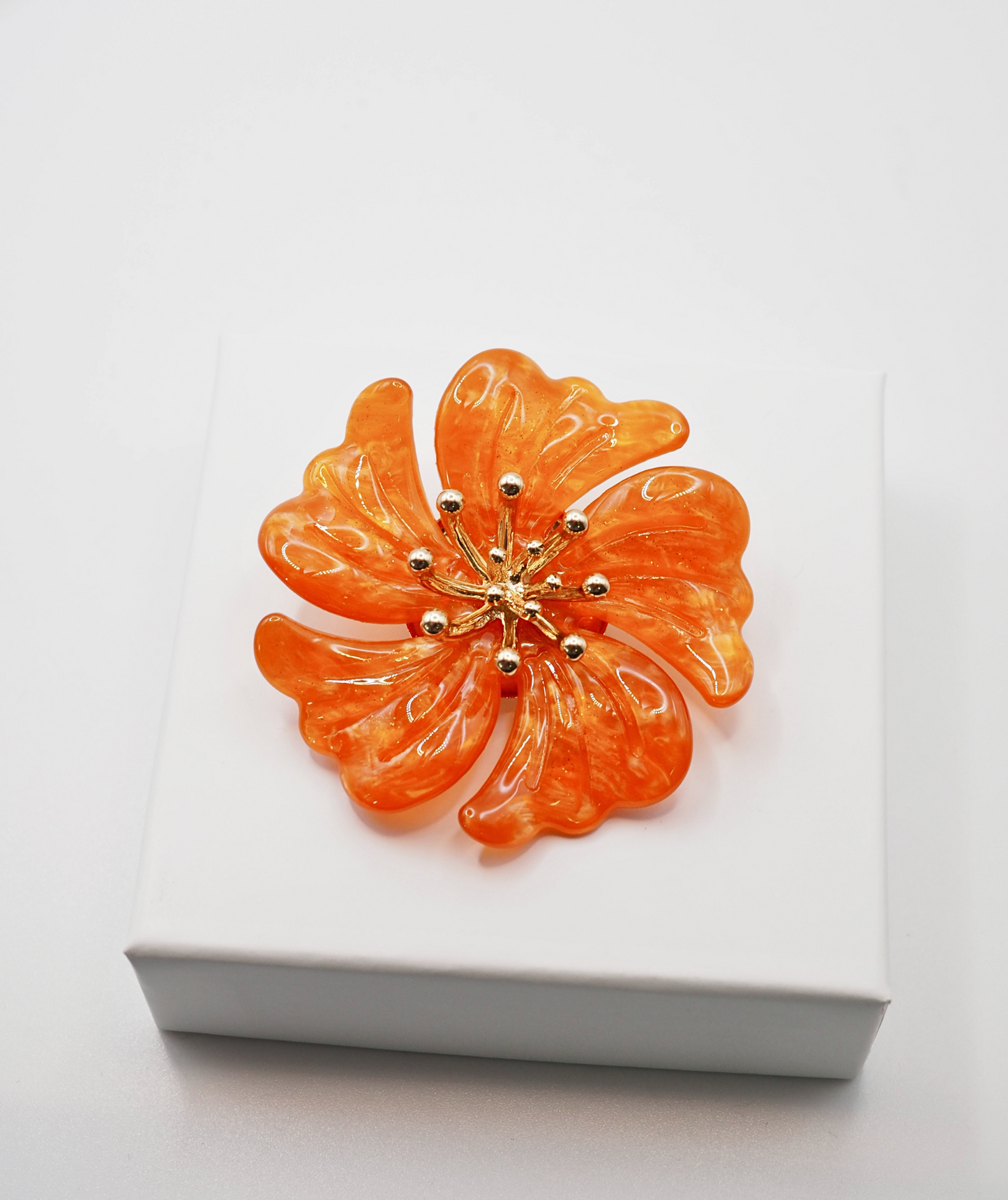 Broche fleur orange